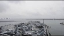 Aircraft Carrier USS Ronald Reagan Arrives at Busa...