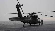 Pre-Flight Checks of a UH-60 Black Hawk in the Sno...