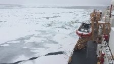 Coast Guard Cutter Polar Star Breaks Ice Supportin...