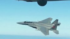F-15 and F-16 Fighters of Air National Guard Fly w...