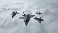 USAF F-22s and Norwegian F-35s Refuel